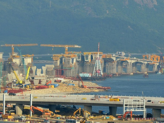 香港旅检大楼上盖工程大延误，港珠澳大桥通车时间仍无法确定